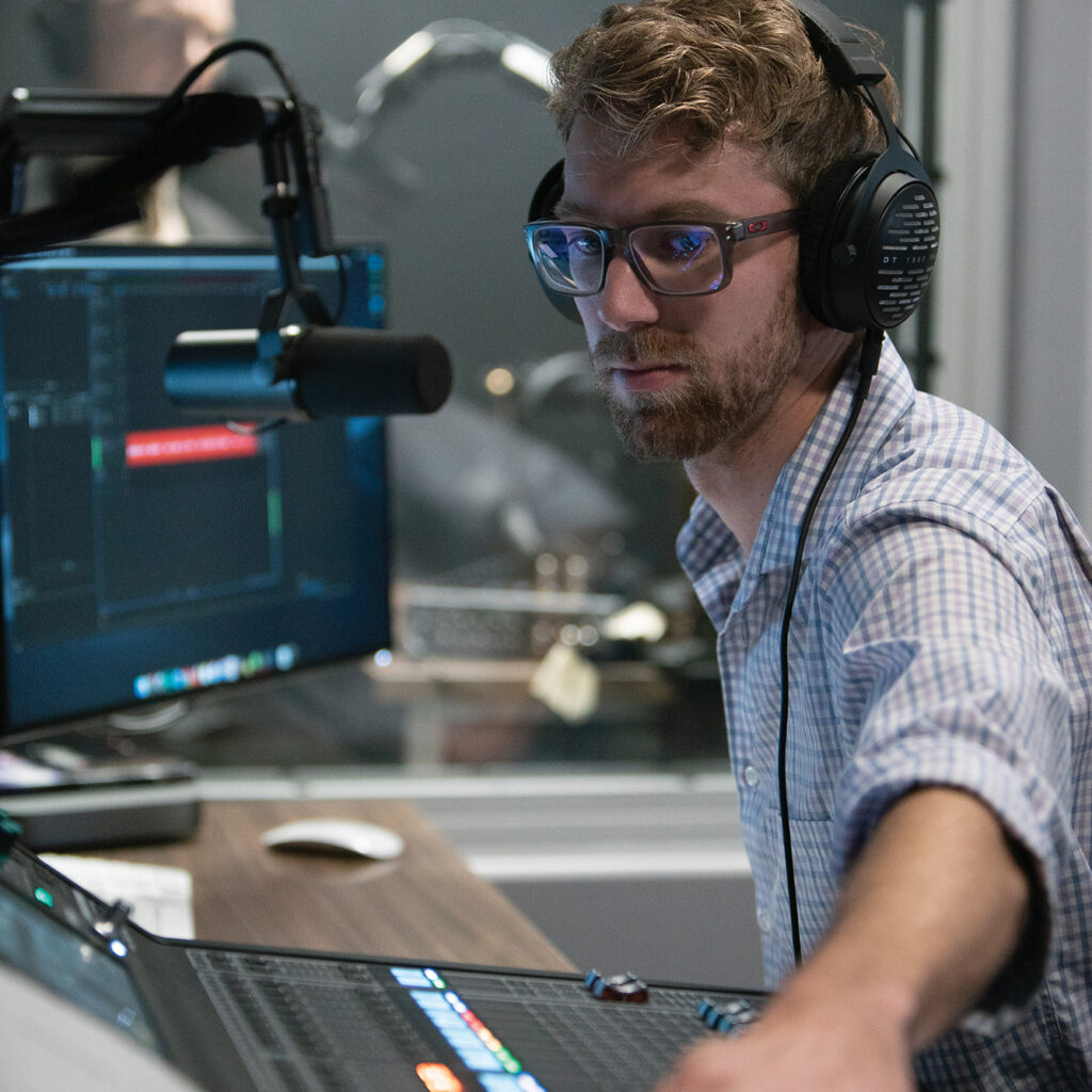 a sound engineer monitors recording